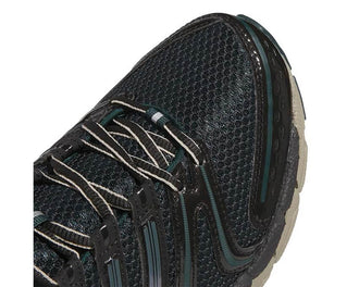 Adidas Adistar Control 5 Core Black vista lateral — mesh negro running estabilidad