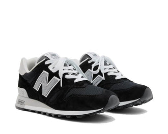 New Balance 1300 Black side view — classic black 1300 USA silhouette