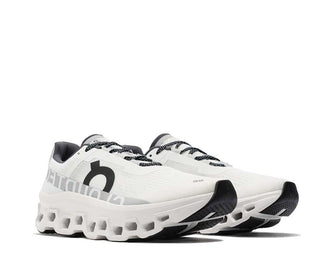 On Cloudmonster All White vista lateral — perfil amortiguación blanco running